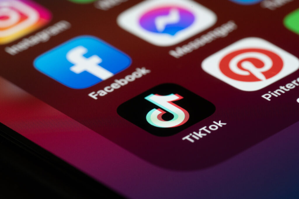 Social media application TikTok on the smartphone screen
